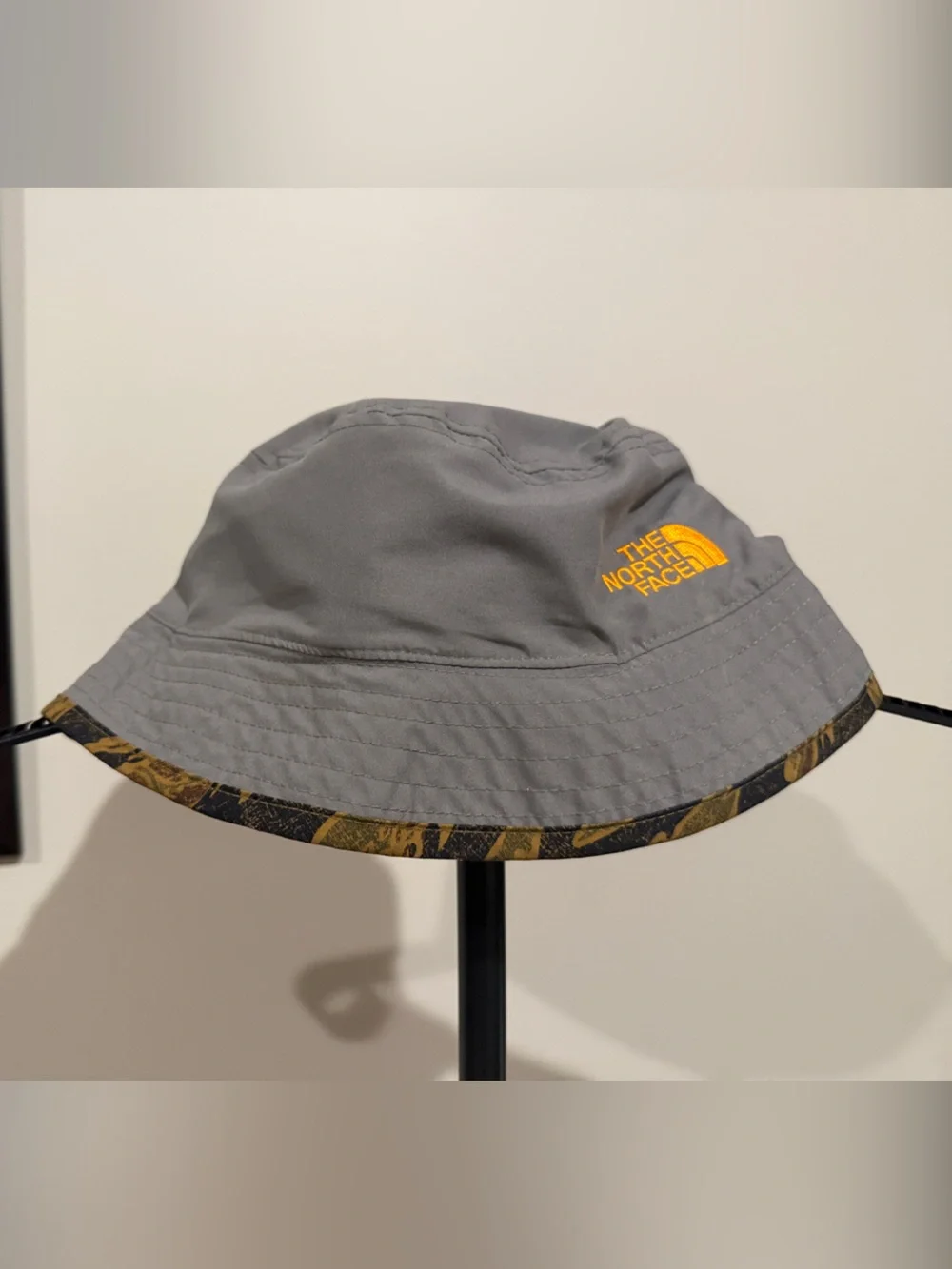 The North Face Reversible Kids Gray Bucket Hat with Orange Logo and Trim